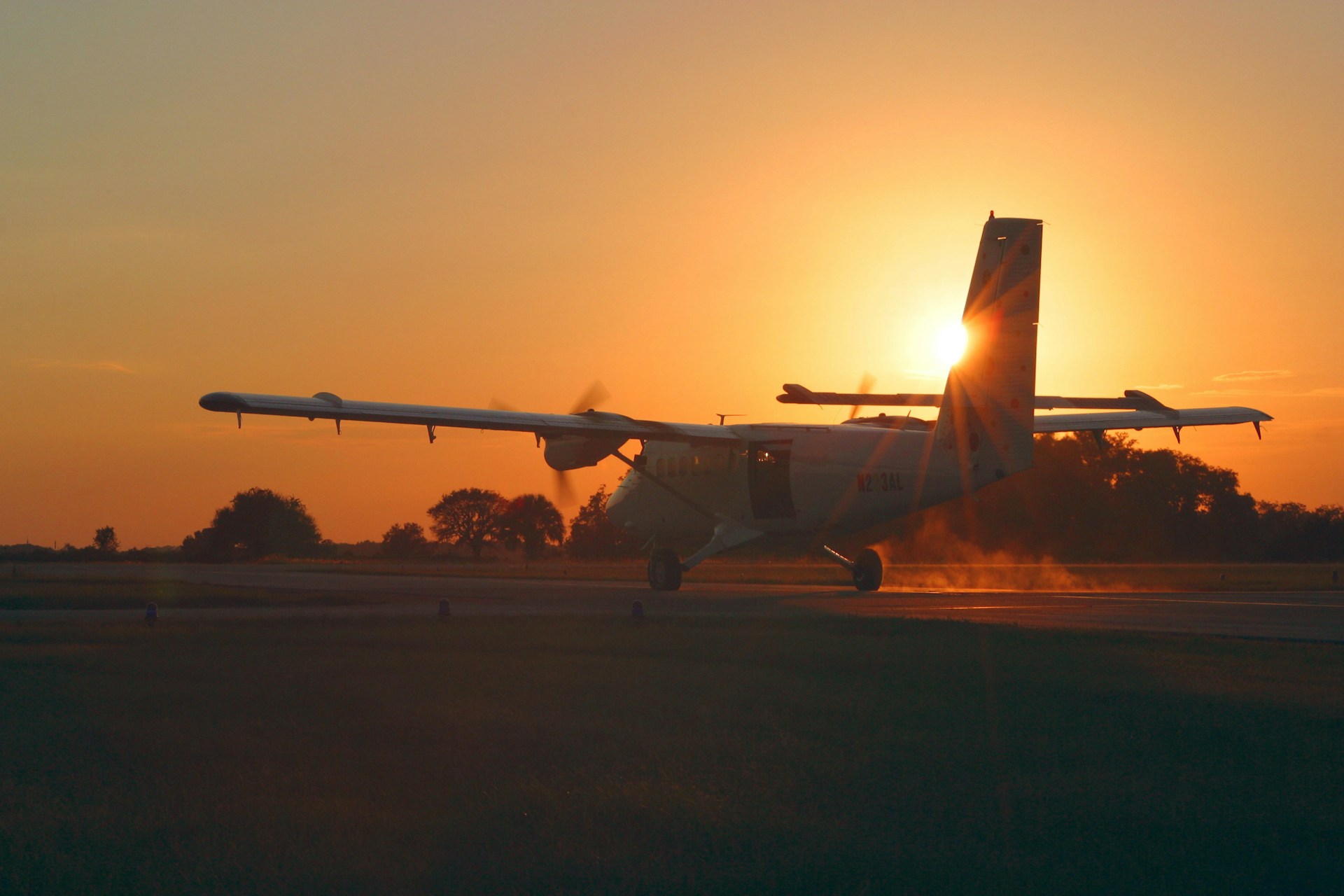 Private charter aircraft taking off at sunset in Australia